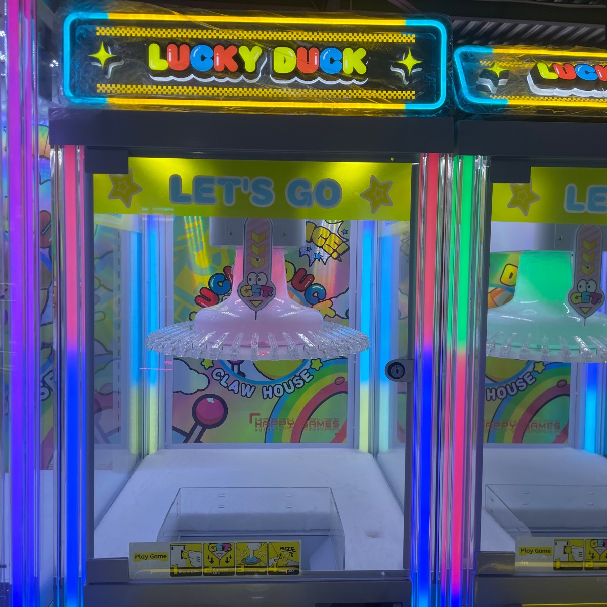 40-clip prize machine with LED lighting cabinet, Lucky Duck clip prize machine installed in arcade entertainment center