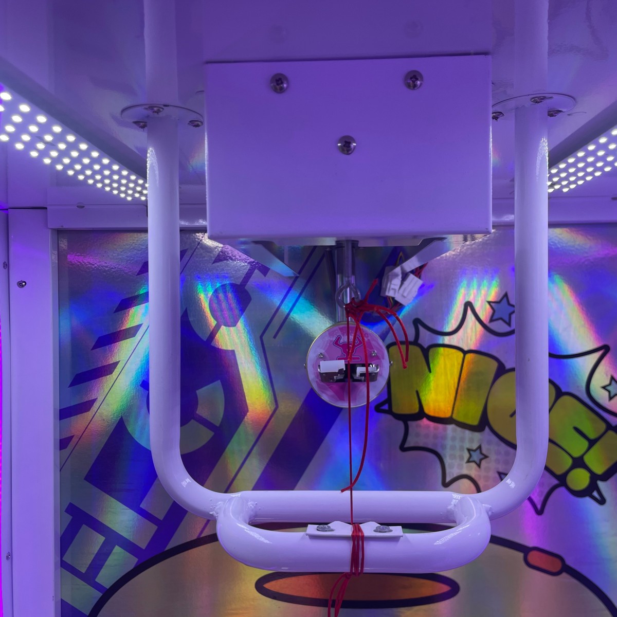 Close-up of scissor cutting mechanism inside Gen 1 Scissor Gift Machine