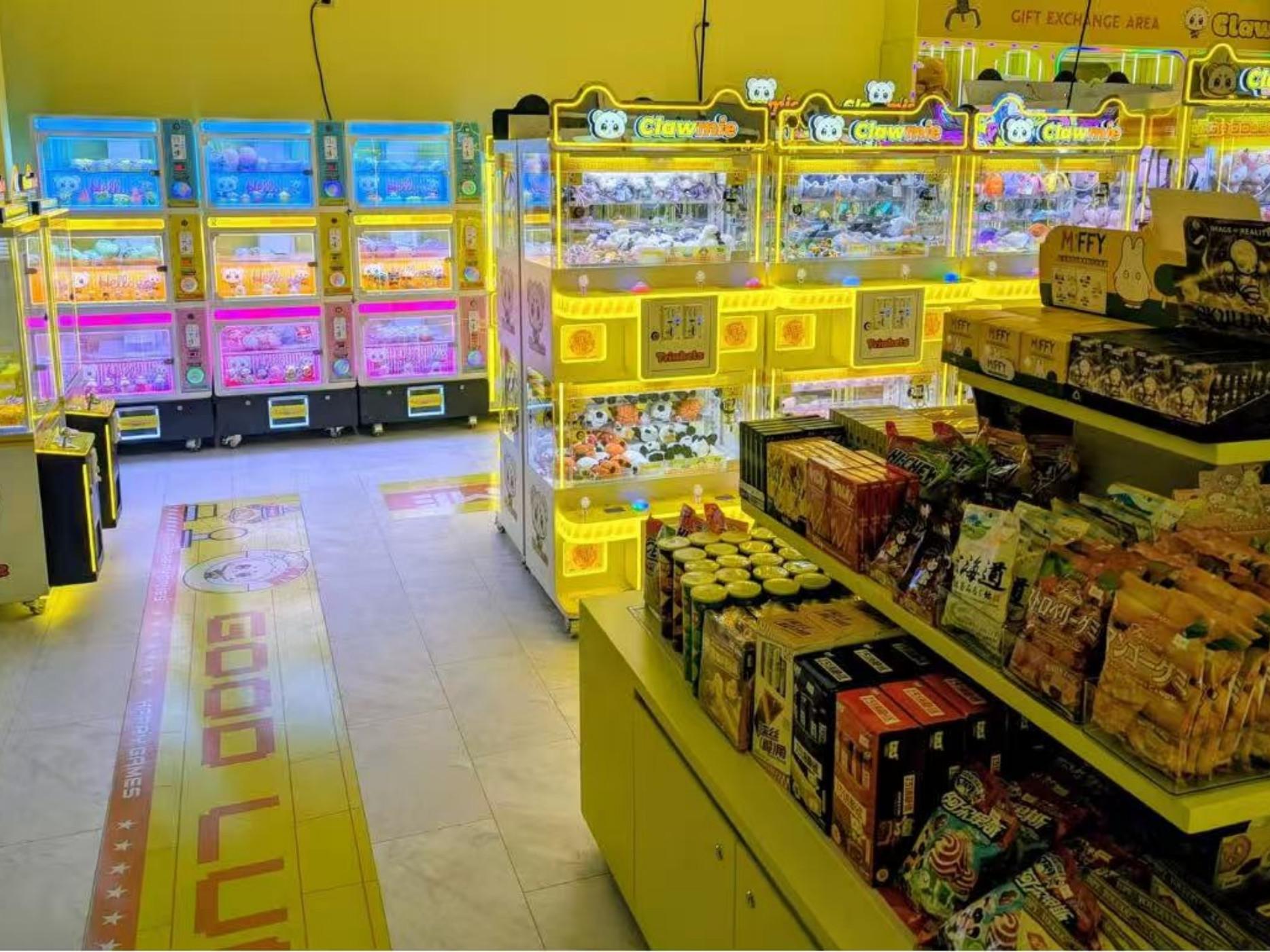 Chengjietian Gen 4 mini claw machines installed in a mixed retail and arcade entertainment environment for small prize operation