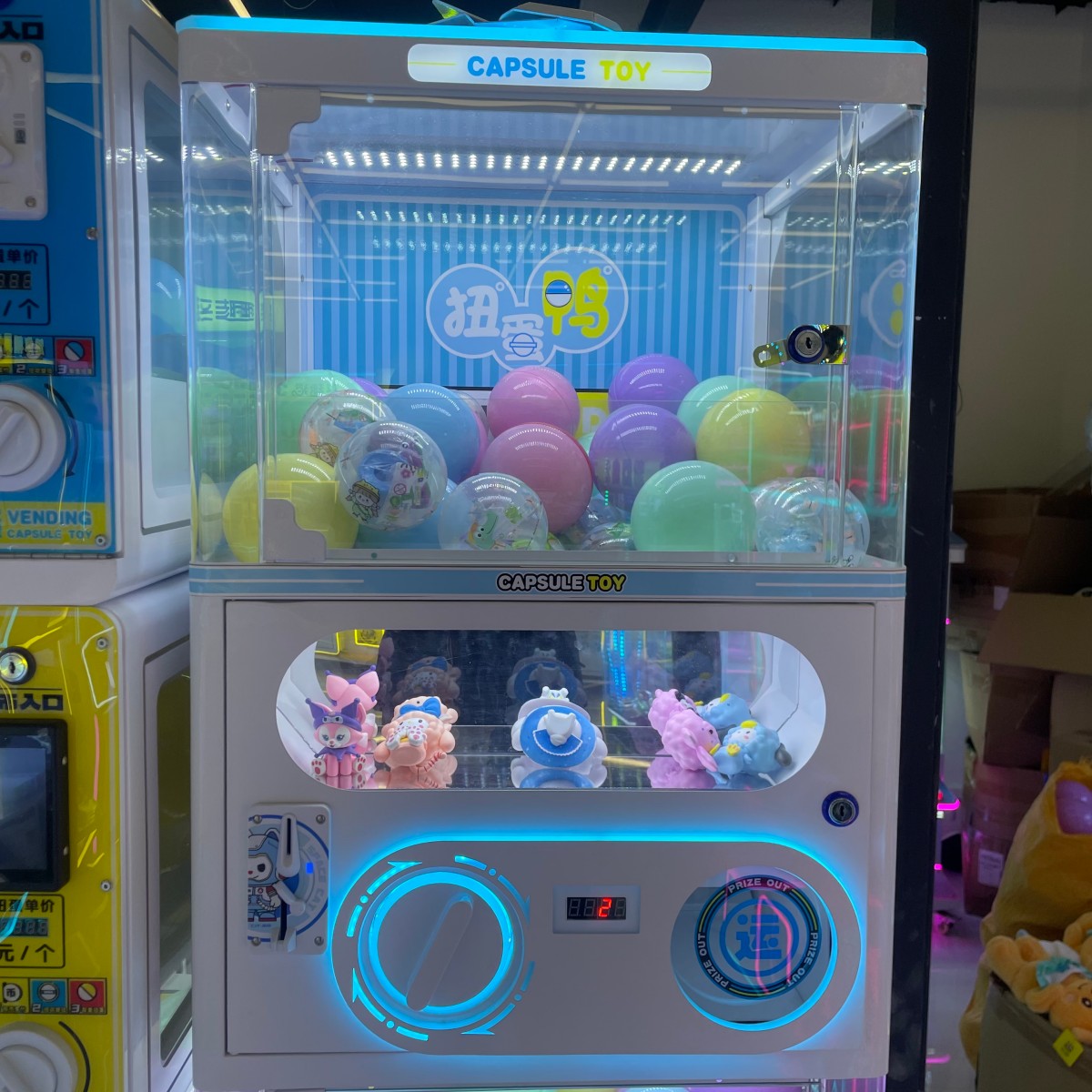 Single capsule toy machine with transparent acrylic cabinet and LED lighting