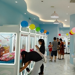 Gen 1 claw machine placed in a small shopping mall kiosk for retail traffic