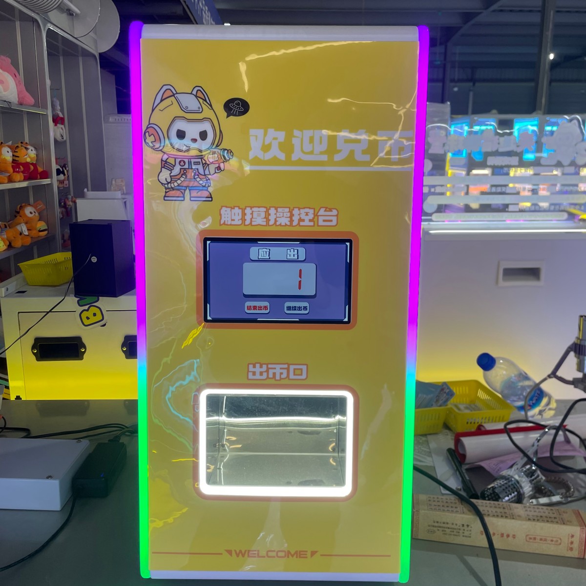 coin changer machine with touchscreen control panel and LED lighting for arcade counter token exchange