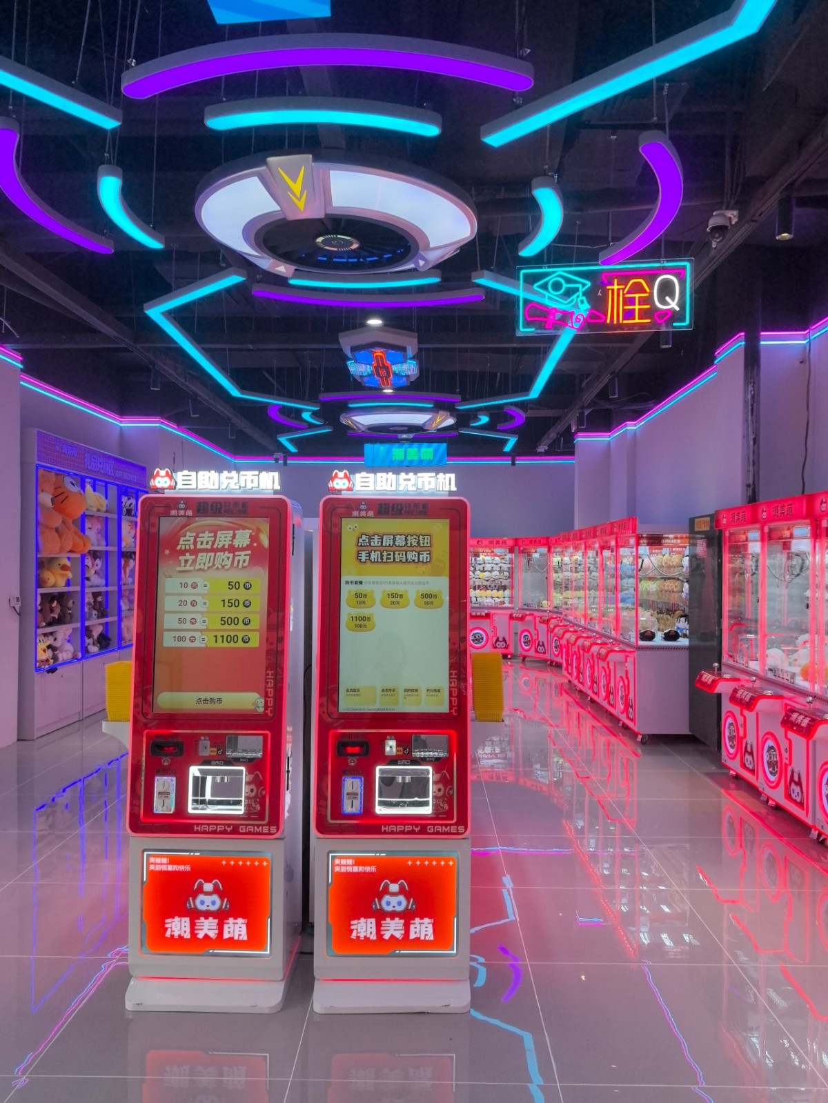 Dual-door coin changer machine with touchscreen interface and cash payment module installed in a high-traffic arcade center